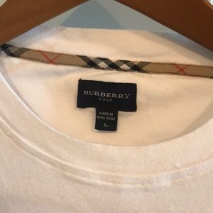 Burberry Tee Large but runs small.